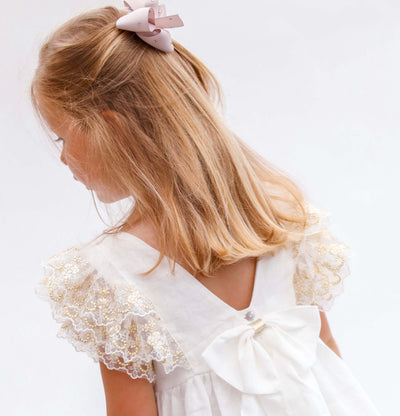 ivory linen girls dress with gold lace shoulders